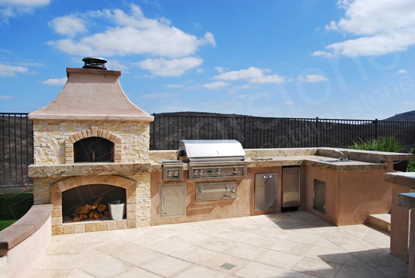 Ivory Stacked Stone Stone Outdoor Kitchen with Pizza Oven in Southern California